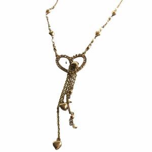 Heart gold tone tassel long length necklace